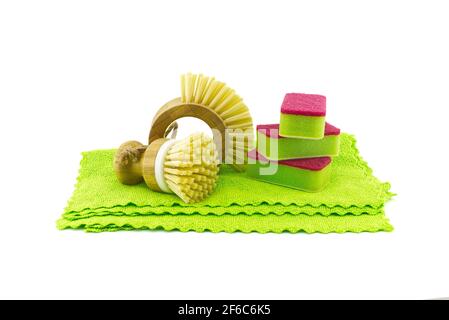 Multicolored cleaning sponges and dish brushes on microfiber cloth isolated on a white background. House cleaning products Stock Photo