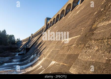 Clatteringshaws Dam wall in the winter sun on the Blackwater of Dee, Galloway Hydro Electric Scheme, Scotland Stock Photo