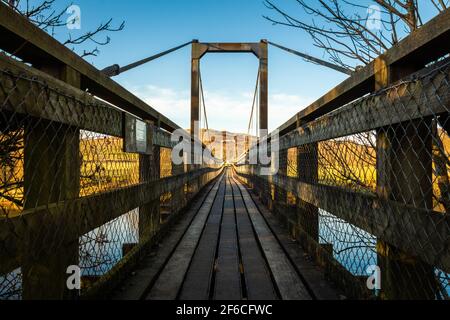 The Boat Weil Wooden Suspension Bridge over the Water of Ken at St.John's town of Dalry, Scotland Stock Photo