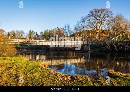 The Boat Weil Wooden Suspension Bridge reflecting over the Water of Ken at St.John's town of Dalry, Scotland Stock Photo