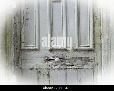 An old door in very poor condition in Penleigh, Westbury, Wiltshire, England, UK. Stock Photo