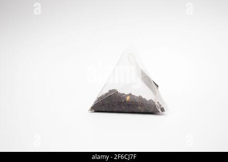 Pyramid tea bag isolated on white background. Stock Photo