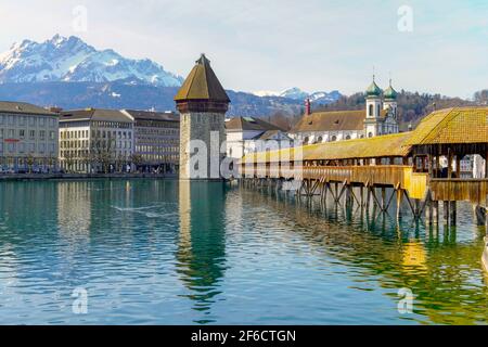 Panoramic view of Lucerne by river Reuss and Chapel Bridge (Kapellbrucke), wooden footbridge spanning the river diagonally, Canton Lucerne, Switzerlan Stock Photo