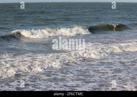 wild whitecaps from the Coral sea hitting the shore, kinetic energy Stock Photo