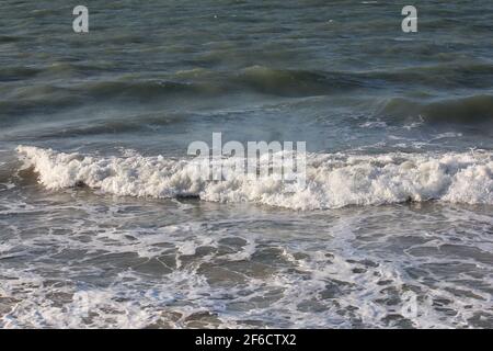 wild whitecaps from the Coral sea hitting the shore, kinetic energy Stock Photo