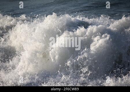 wild whitecaps from the Coral sea hitting the shore, kinetic energy Stock Photo