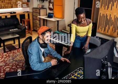 Stock photo of cool artists working in professional music studio. Stock Photo