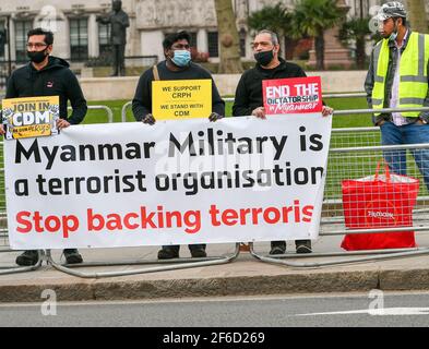 London, UK. 31st Mar, 2021. A protest against the military regime in Myanmar outside the Houses of Parliament Credit: Ian Davidson/Alamy Live News