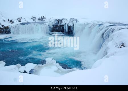 Goðafoss waterfall complex during winter conditions showing the 12 metre drop full of ice features on the  river Skjálfandafljót in Iceland