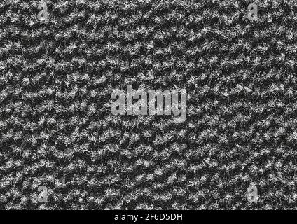 Dark carpet texture with abstract wavy pattern, background, close-up. Stock Photo