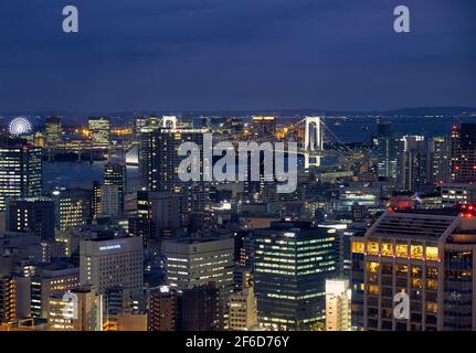 Tokyo, Japan - October 23, 2019: The night view of northern Tokyo Bay with Rainbow Bridge between Shibaura and Odaiba artificial island in Minato city Stock Photo