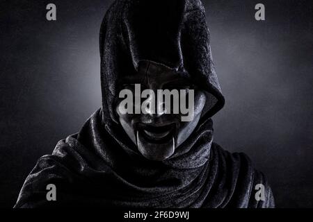 Portrait of a scary figure in hooded cloak Stock Photo - Alamy