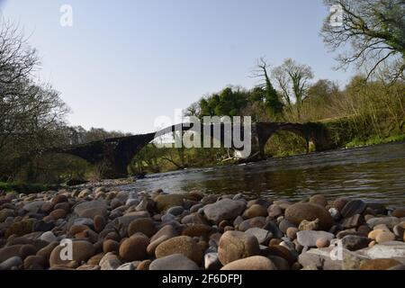 Oliver Cromwell's crossing of the river hodder bridge in 1648 enroute to the battle of Preston -English civil war. Stock Photo