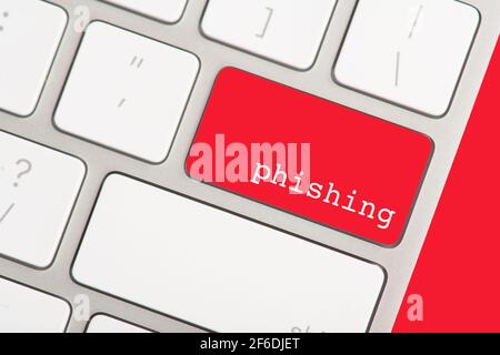 The return button on a computer keyboard is red as a sign not to press because it may lead to phishing Stock Photo