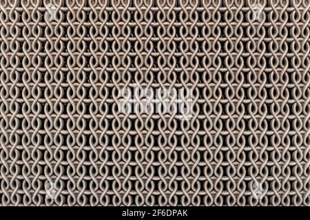 Seamless texture of brown plastic basket with abstract repeating wavy patterns background. Stock Photo