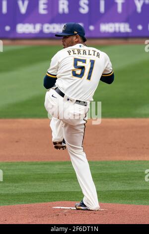 Milwaukee Brewers relief pitcher Freddy Peralta (51) during a spring training game against the Chicago White Sox, Friday, March 26, 2021, in Phoenix, Stock Photo