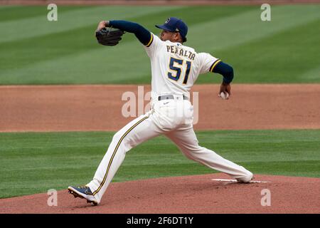 Milwaukee Brewers relief pitcher Freddy Peralta (51) during a spring training game against the Chicago White Sox, Friday, March 26, 2021, in Phoenix, Stock Photo