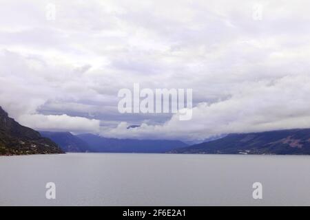 beautiful view of the Norwegian. Summer in Norway. Cloudy scandinavian sky. Mountains and rocks. Stock Photo
