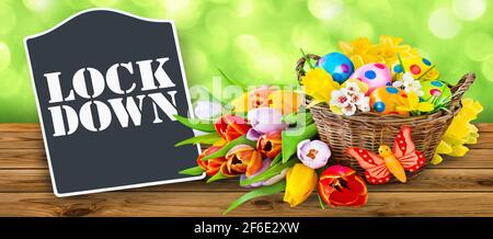 Lockdown and Easter decoration on wooden background Stock Photo