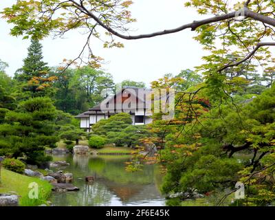 The view of the house, gardens and pond on a grey day. At Hachijō-no-miya royal villa in Kyoto, Japan. Stock Photo