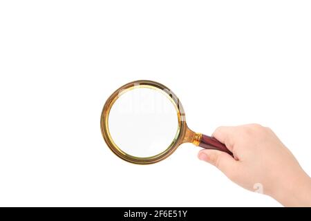 Magnifying glass in child hand on white background, isolate Stock Photo