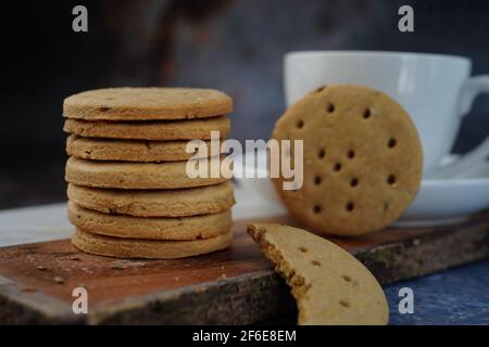 Homemade Indian Atta biscuits - Whole wheat Cumin cookies served with tea, selective focus Stock Photo