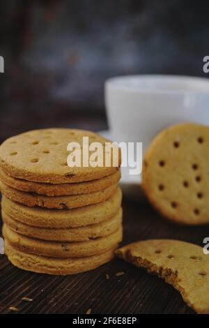Homemade Indian Atta biscuits - Whole wheat cookies served with tea, selective focus Stock Photo