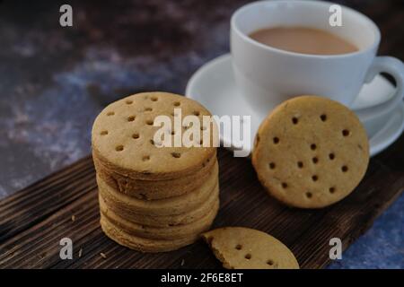 Homemade Indian Atta biscuits - Whole wheat Cumin cookies served with tea, selective focus Stock Photo