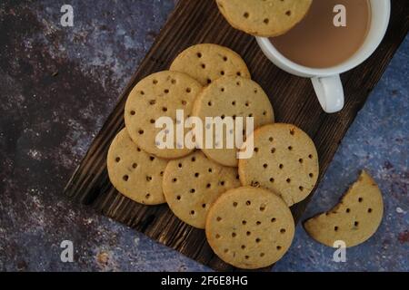 Homemade Indian Atta biscuits - Whole wheat cookies served with tea, selective focus Stock Photo