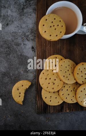 Homemade Indian Atta biscuits - Whole wheat cookies served with tea, selective focus Stock Photo