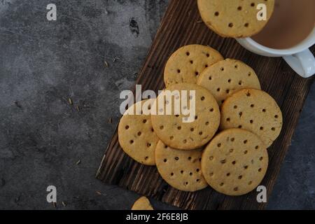 Homemade Indian Atta biscuits - Whole wheat cookies served with tea, selective focus Stock Photo