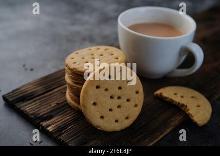 Homemade Indian Atta biscuits - Whole wheat Cumin cookies served with tea, selective focus Stock Photo
