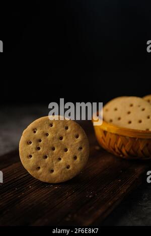 Homemade Indian Atta biscuits - Whole wheat cookies served with tea, selective focus Stock Photo