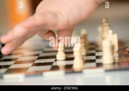 Close up of Hands Playing Chess Stock Photo