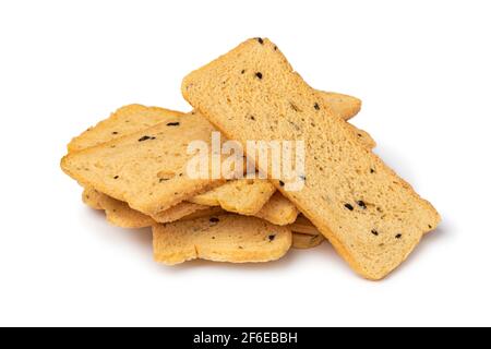 Heap of fresh baked thin melba toast isolated on white background Stock Photo