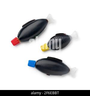 Plastic fish shaped bottles with colorful caps filled with soy sauce isolated on white background Stock Photo