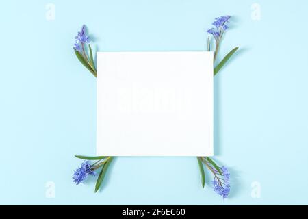 Blank canvas mockup with frame made of snowdrop flowers Stock