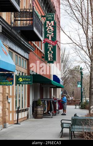 HENDERSONVILLE, NC, USA--23 MARCH 2021: Main Street in Hendersonville on an early spring day, with Mast General Store open for business.  People. Stock Photo