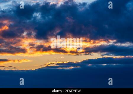 Beautiful Sunset with Colorful Clouds and Blue Sky Stock Photo