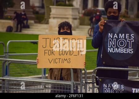 London, United Kingdom. 31st March 2021. Covid-19 victim protesters outside the Houses of Parliament. A handful of demonstrators gathered outside the parliament to protest the new bill, government's handling of Covid, Brexit and plastic pollution. Credit: Vuk Valcic/Alamy Live News