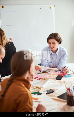 Contented fashion designer admiring new color palettes Stock Photo