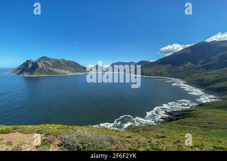 Scenic view of Hout Bay, near Cape Town, South Africa against blue sky seen from viewpoint at Chapmans Peak Drive Stock Photo
