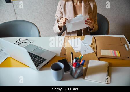 Focused photo on female that opening envelope Stock Photo