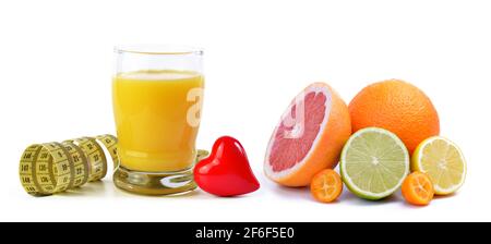 Orange juice in glass, tape measure, heart and citrus fruits isolated on a white background. Concept of healthy nutrition. Stock Photo