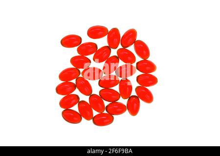 Krill oil red gelatin capsules on white background.Source of omega fatty acids.Healthy food.krill oil supplements