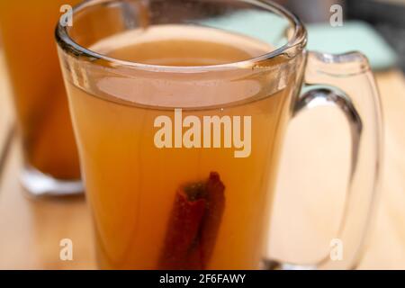 An autumn cup of Hot Apple Cider with a cinnamon stick garnish in downtown Toronto, Canada — the perfect fall beverage for keeping warm. Stock Photo
