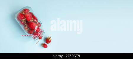 Flat lay composition of fresh strawberry berry fruits in glass bottle. Minimal composition. Flat lay, top view Stock Photo