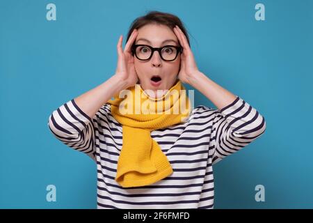 Beautiful mixed race businesswoman smiling with open mouth and open palms Stock Photo