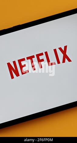 vertical photo of a tablet with netflix streaming provider logo on the screen Stock Photo
