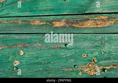 Old wood planks wall background. Grungy wood texture design. Abstract pattern of rusty green wooden panels Stock Photo